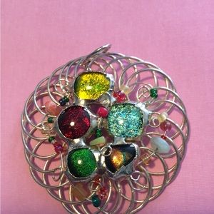 Vintage MCM  round silvertone wire wrapped brooch with dichroic stones